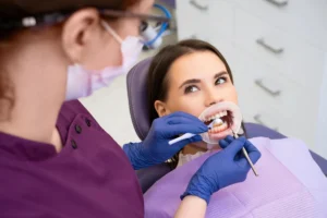 Dentist examining patient smile at general dentistry in Franklinville, NJ clinic
