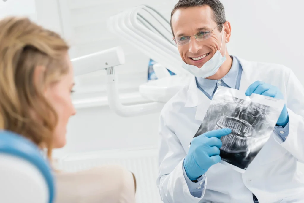 Franklinville dentist explaining dental X ray results.