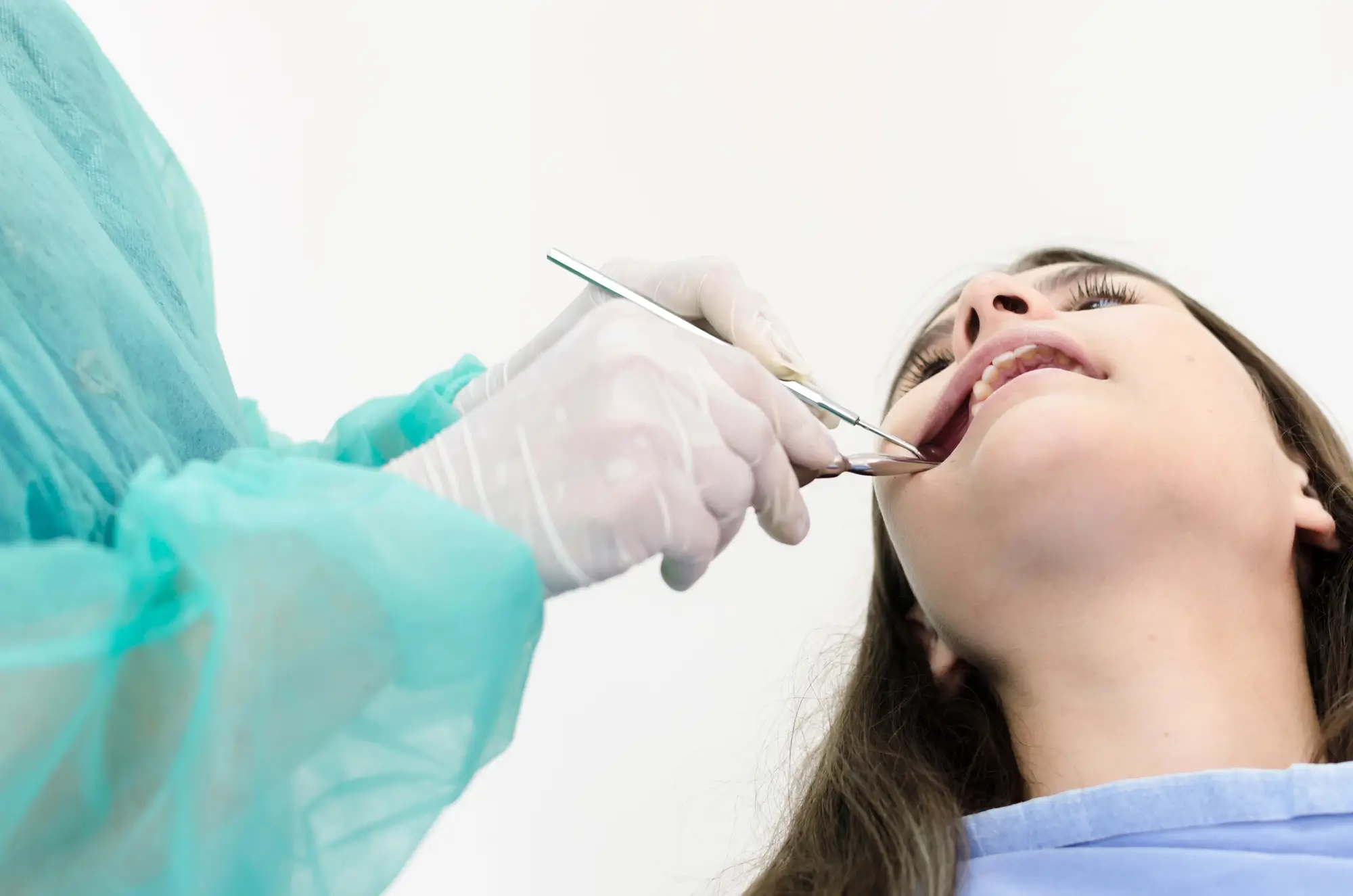Emergency Dentist Franklinville NJ performing a tooth extraction.