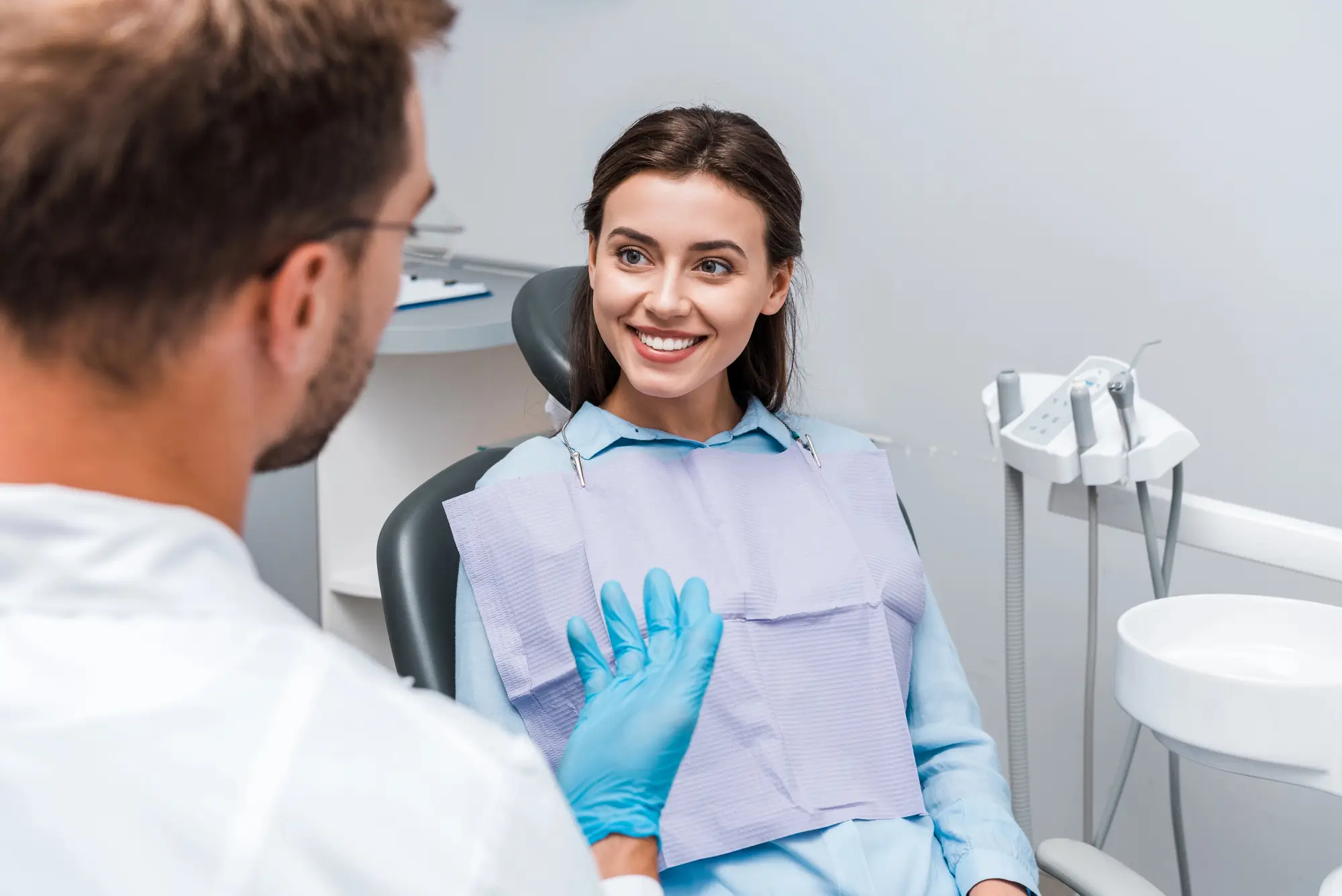 Patient consulting a dentist about Composite Veneers treatment.