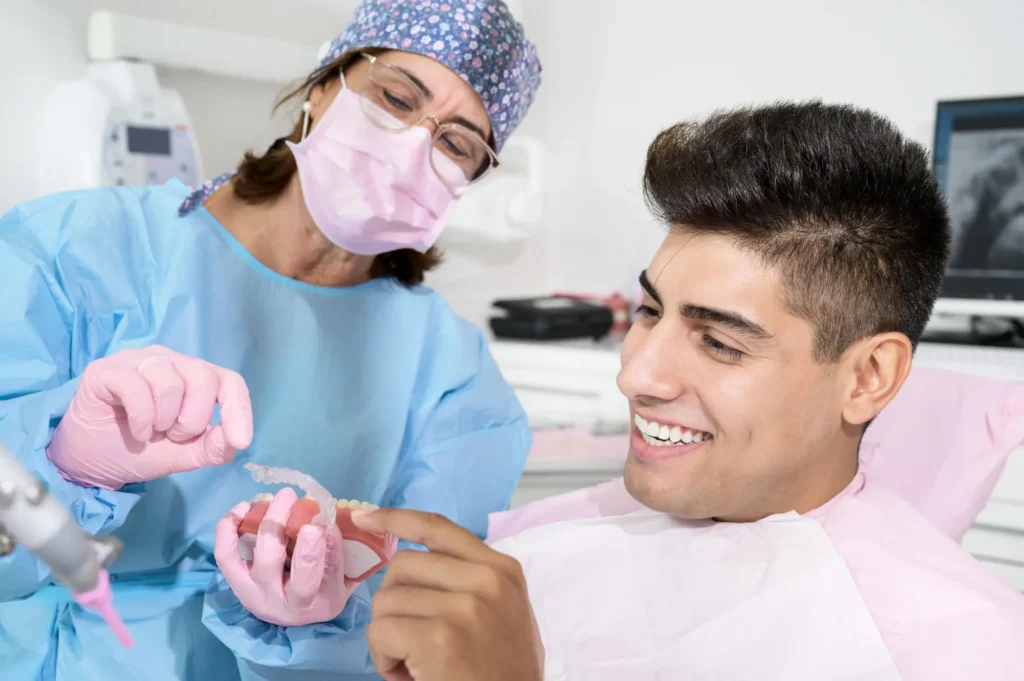 Dentist showing Invisalign options to a patient in Franklinville NJ